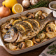 Дорадо запеченная с репчатым луком, лимоном, розмарином